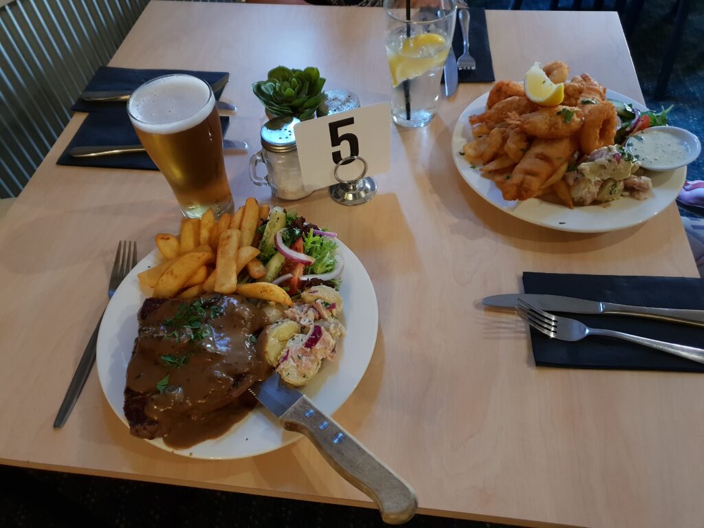 A lovely steak, salad and chips.