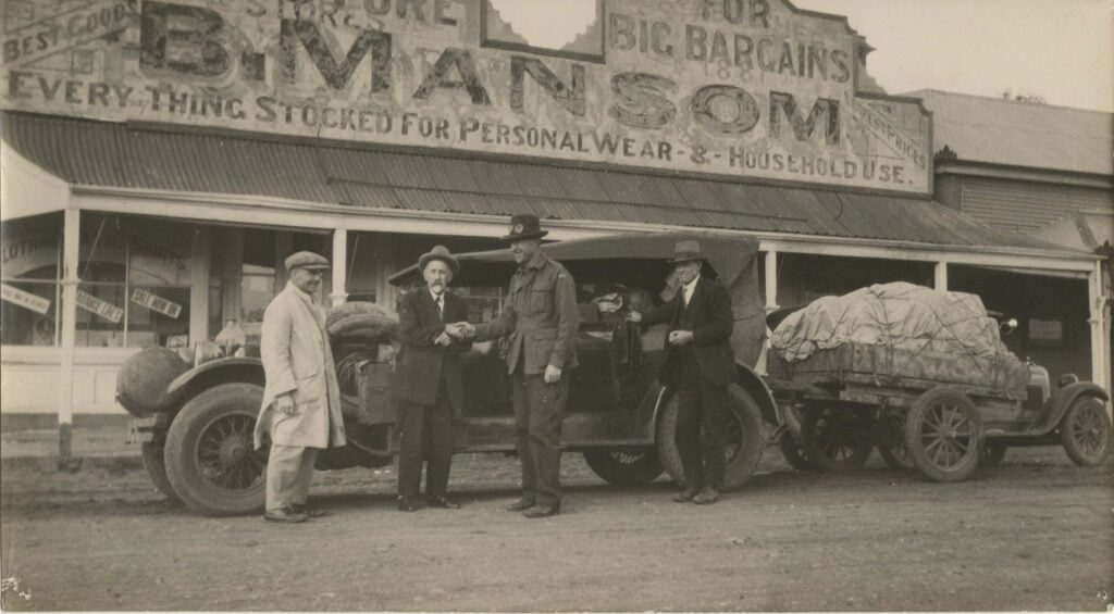 ALBERT PACKER in front of Mansom store Hawker
